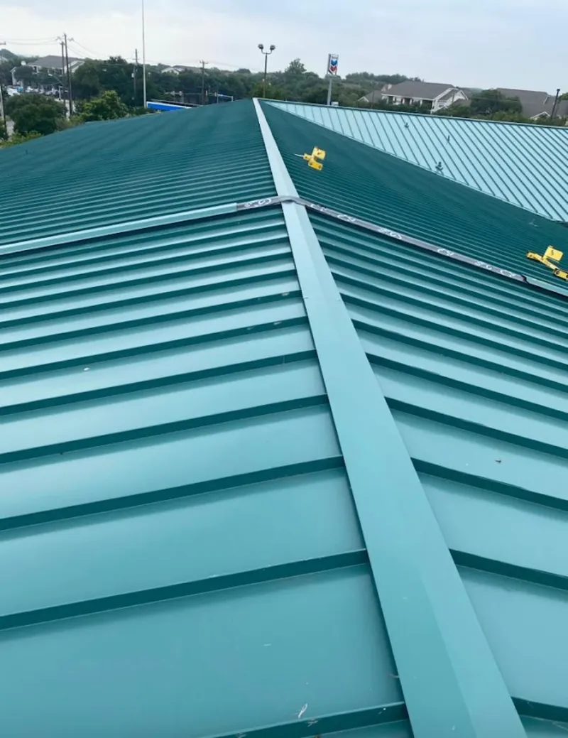 Green commercial metal roof ridge and valley for Metal Roof Repair in Collinsville